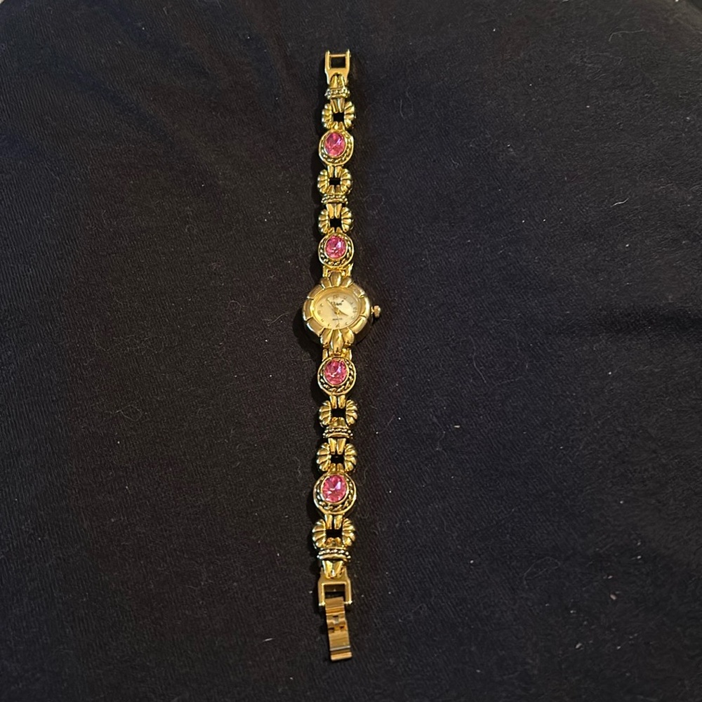 Women’s gold tone watch set with pink stones